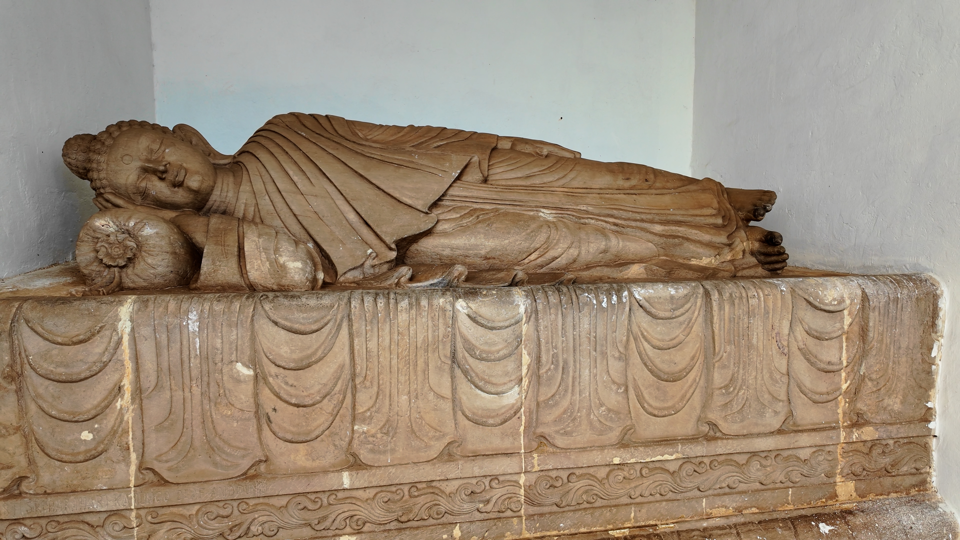 One of the four Buddha statues facing the cardinal directions on the Peace Stupa