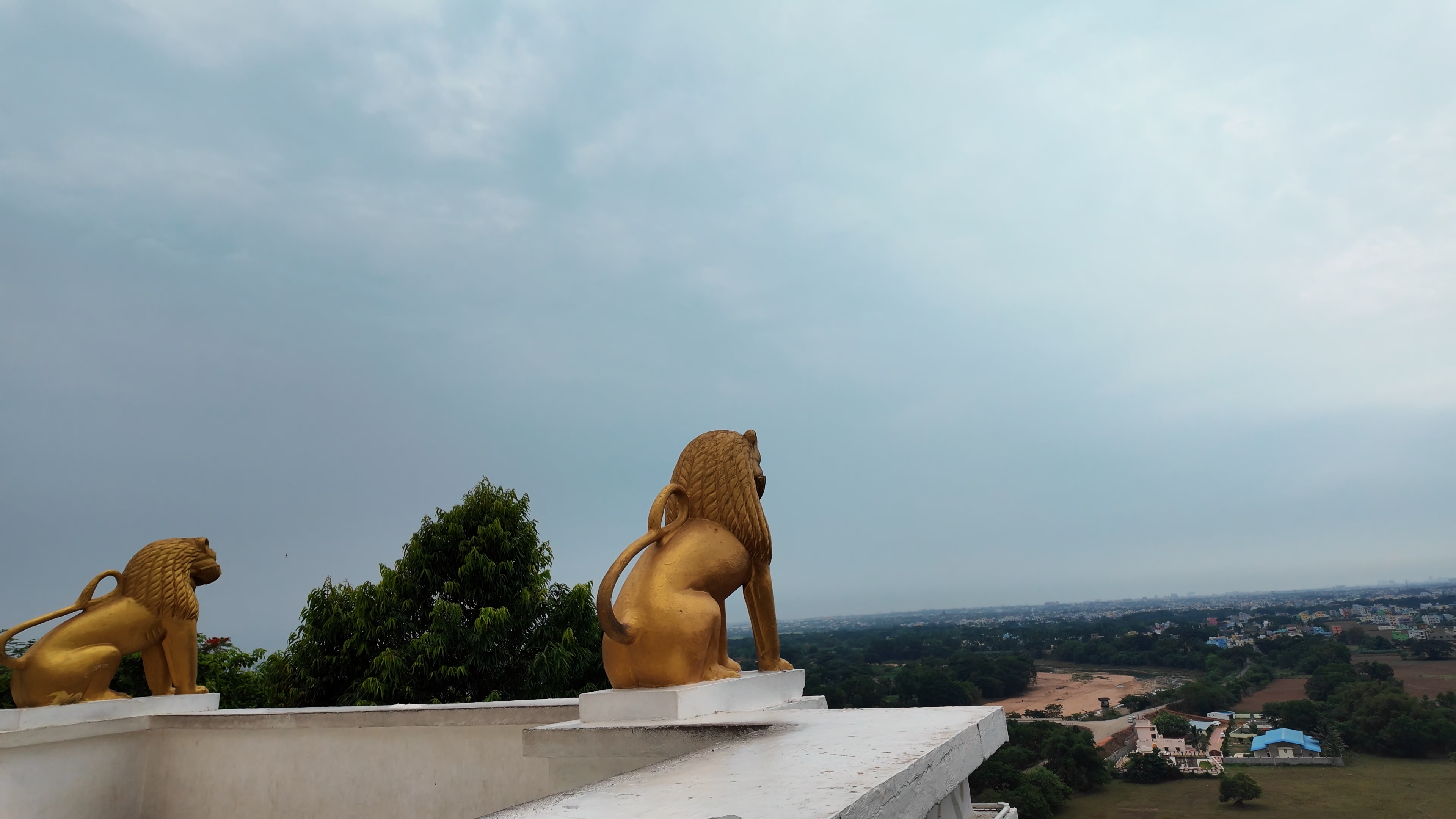 Lion statues at the corners of the Dhauli Peace Stupa, symbolising Bodhisattvas