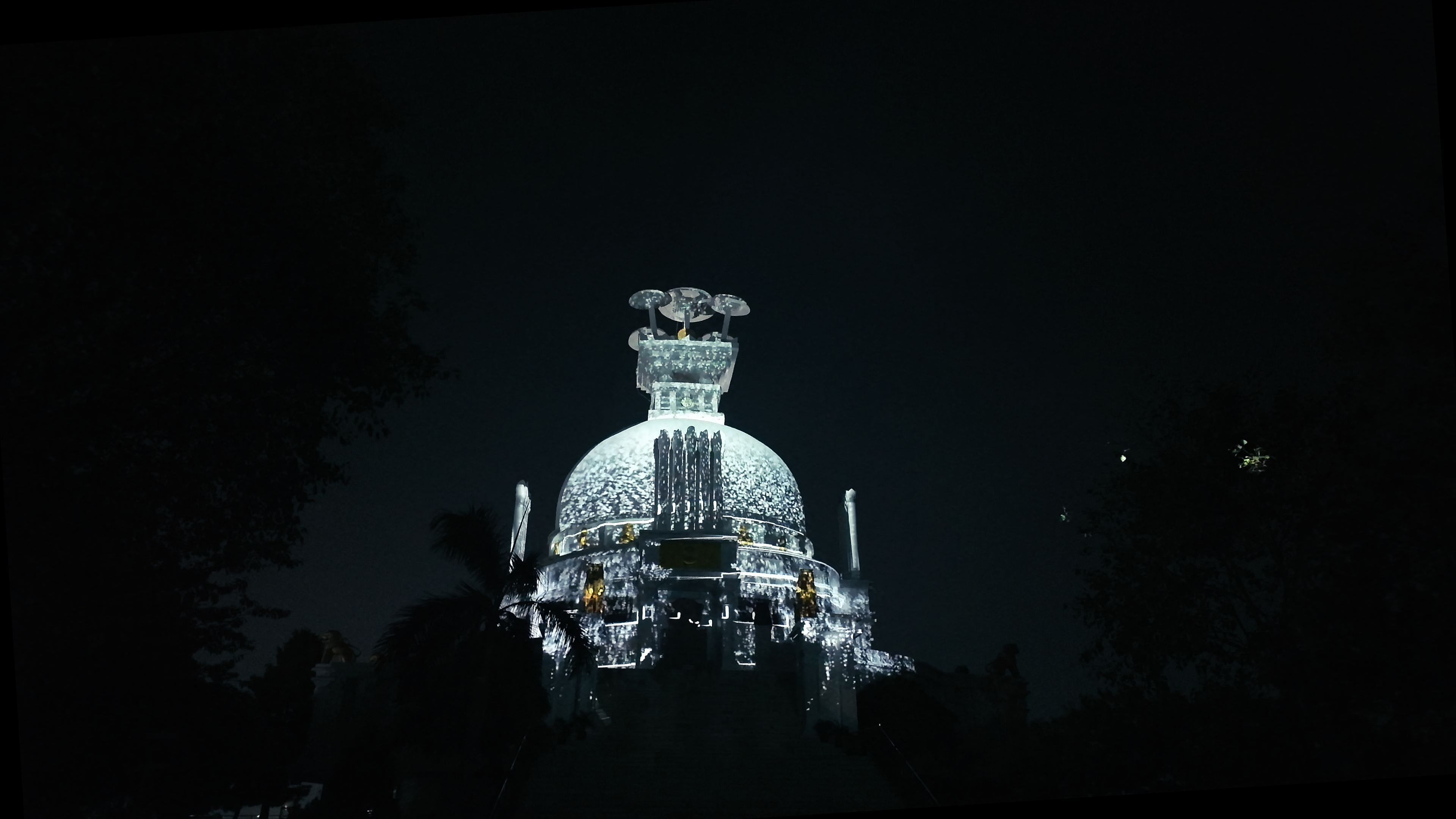 Colours of the evening light and sound show on the Peace Stupa at Dhauli