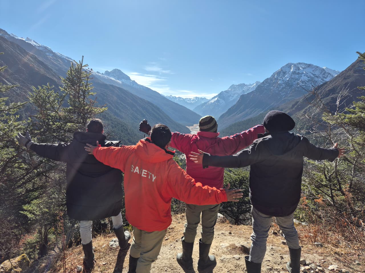 Four friends together at a viewpoint during the Sikkim trip